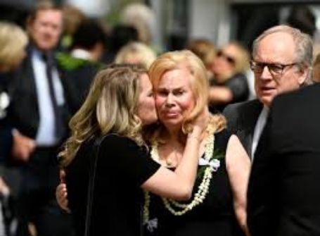Annabel with her daughter at Pat's funeral